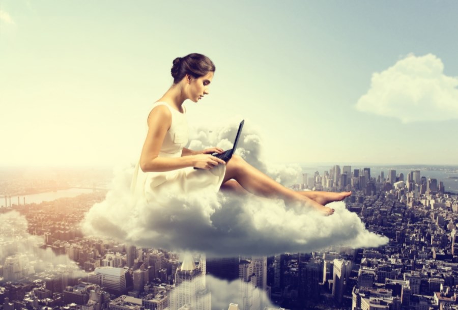 Woman On Laptop In the Clouds